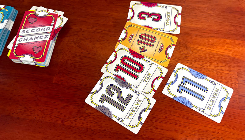 Flip 7 cards: 12, 10, 11, 3, and +10