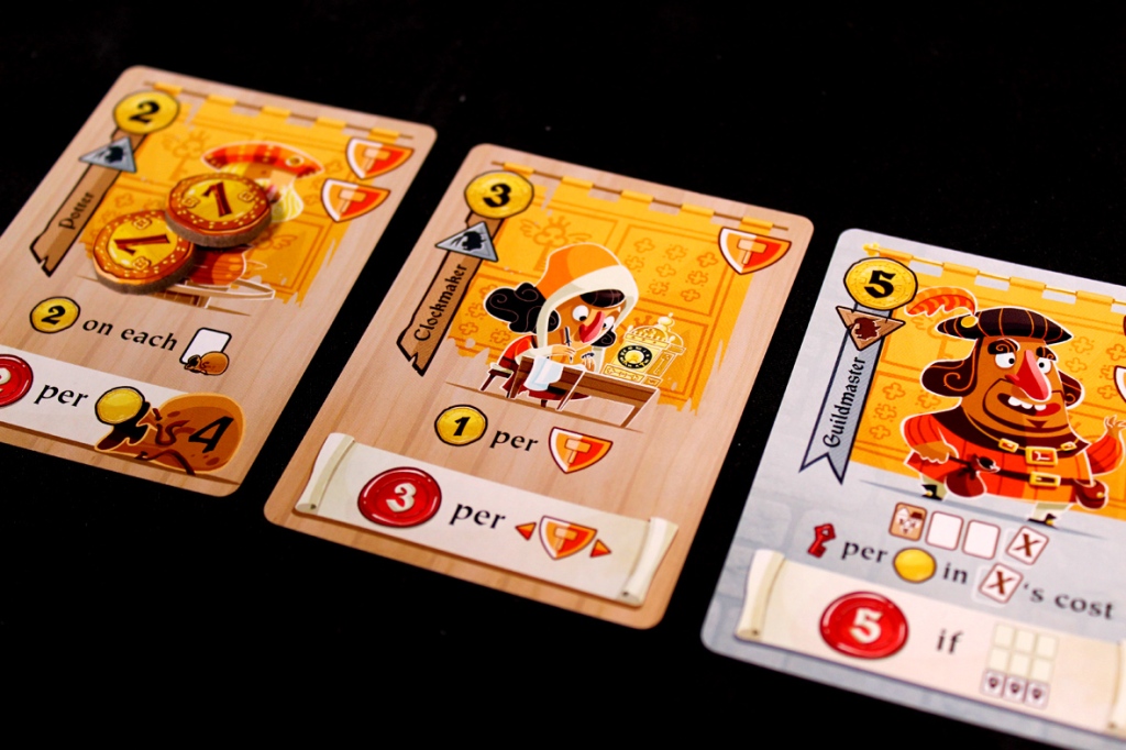 Three gameplay cards from the board game Castle Combo featuring unique characters and abilities, with illustrations and associated scoring details.